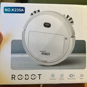 NEW IN BOX Robot Sweeping Vacuum